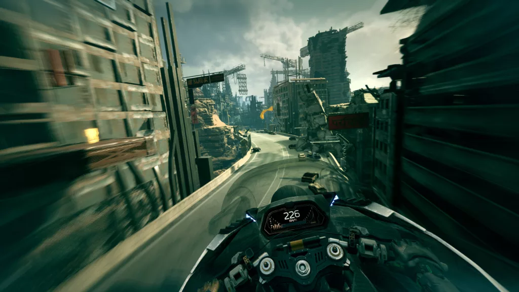 Crumbling, post apocalyptic city buildings and a highway. The player rides a motorbike in first person. 