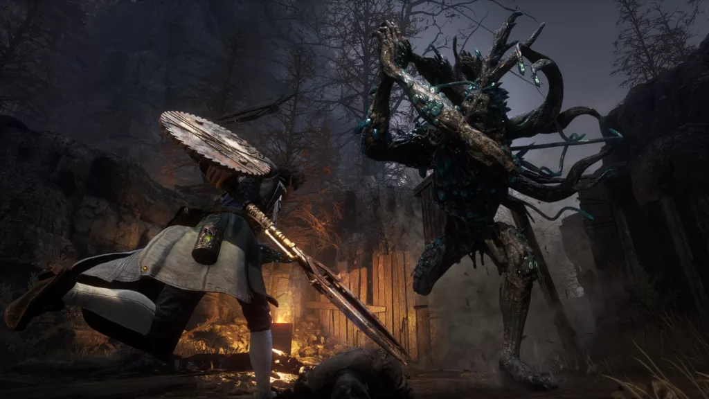 The main character is in a forest running towards a towering mutated enemy with tentacle arms.